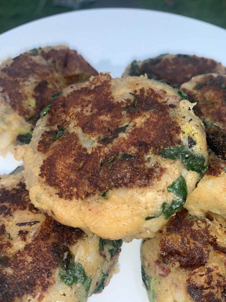 Close-up of potato kale cakes on plate