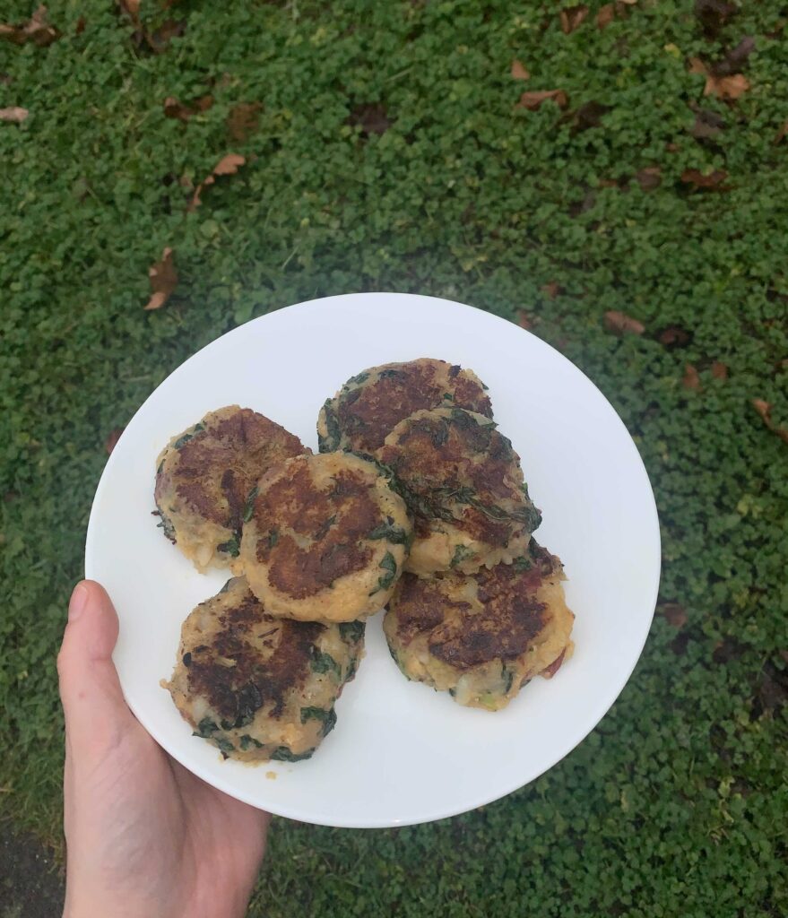 Plate of several potato kale cakes 