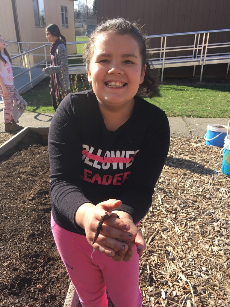 Girl holding worm